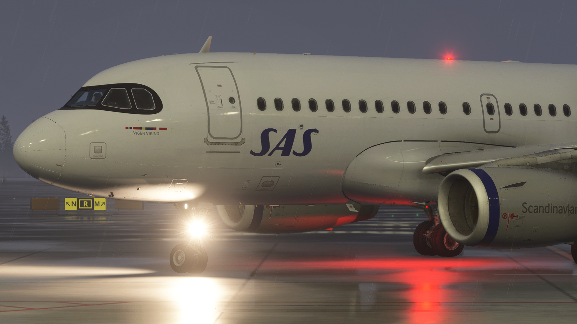 SAS Viger Viking taxiing in the rain at night